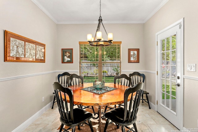 dining space with crown molding and an inviting chandelier