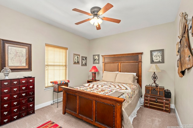 bedroom featuring ceiling fan and light colored carpet