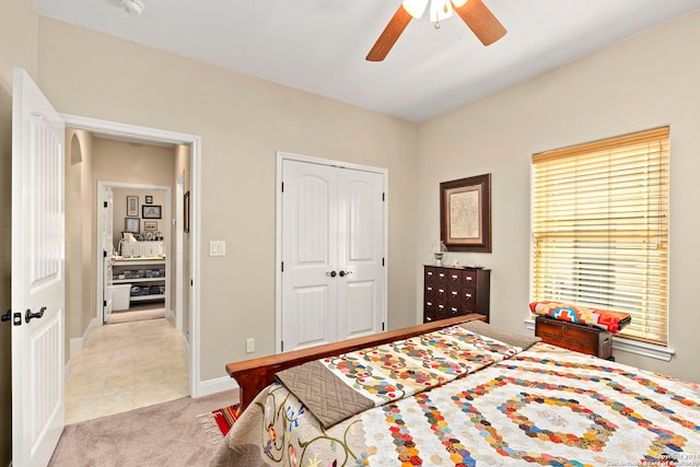 bedroom with light carpet, a closet, and ceiling fan