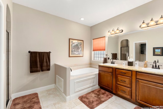 bathroom featuring vanity, separate shower and tub, and tile patterned floors