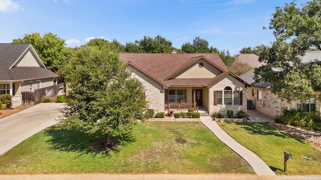 view of front of house featuring a front yard and covered porch