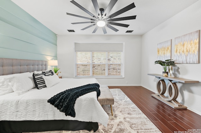 bedroom with dark wood-type flooring and ceiling fan