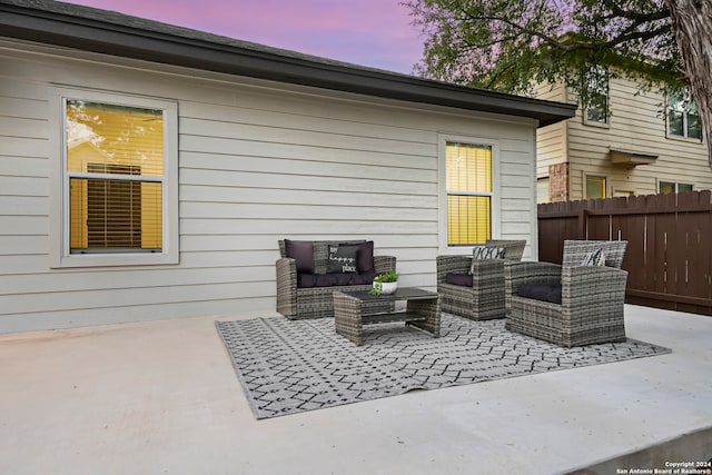 patio terrace at dusk with an outdoor hangout area