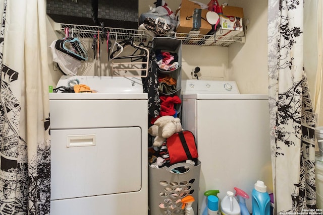 clothes washing area featuring washer / clothes dryer