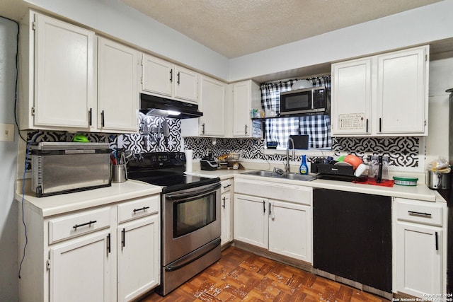 kitchen featuring tasteful backsplash, appliances with stainless steel finishes, sink, dark parquet flooring, and white cabinets