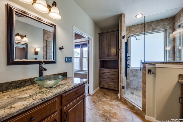 bathroom featuring vanity and walk in shower