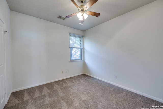 unfurnished room with carpet and ceiling fan