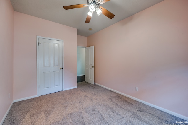 unfurnished bedroom with light carpet and ceiling fan