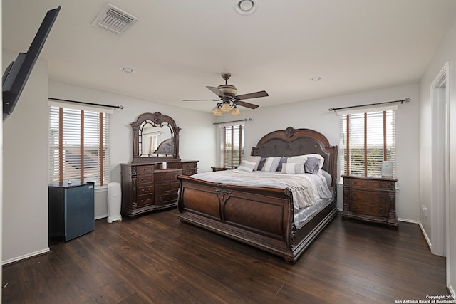 bedroom featuring ceiling fan and dark hardwood / wood-style flooring