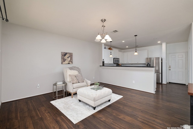 sitting room featuring dark hardwood / wood-style flooring