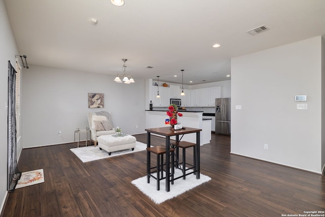 6720 Marble Lk, Live Oak, TX 78233 - living area featuring dark wood-type flooring, a chandelier, recessed lighting, and baseboards