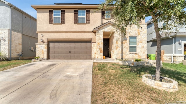 view of front facade featuring a front yard and a garage