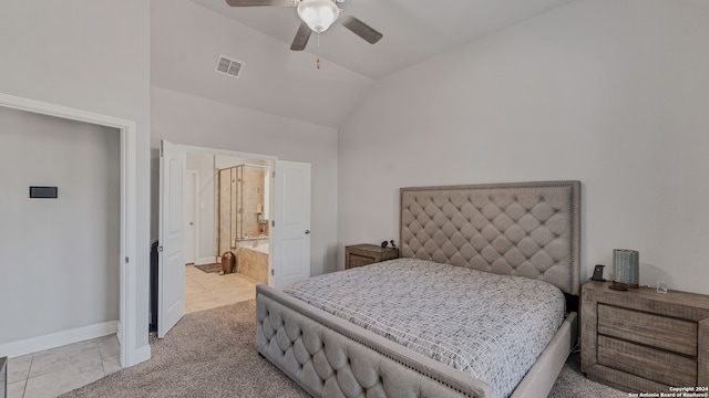 carpeted bedroom featuring ensuite bathroom, ceiling fan, and vaulted ceiling