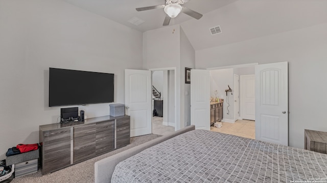 bedroom with connected bathroom, ceiling fan, high vaulted ceiling, and light colored carpet