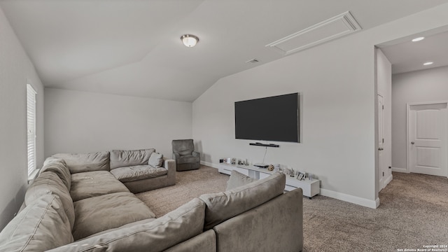 living room featuring carpet flooring and vaulted ceiling