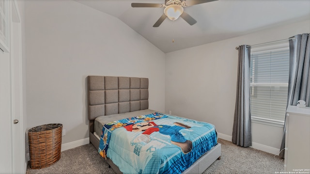 carpeted bedroom featuring ceiling fan and vaulted ceiling