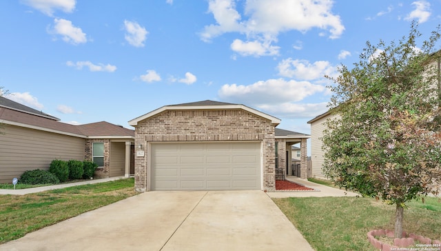 view of front of house with a front yard and a garage