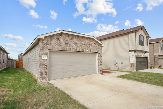 exterior space with a front yard and a garage