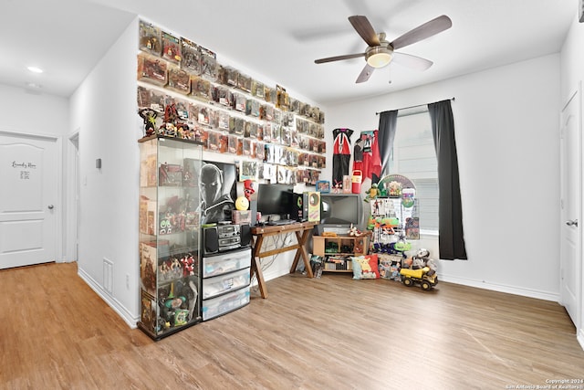 office featuring hardwood / wood-style flooring and ceiling fan