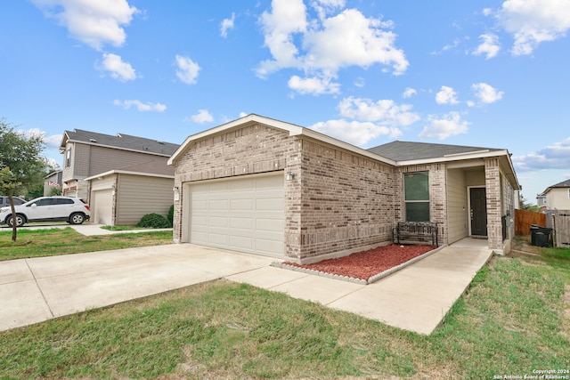 view of front facade with a front lawn and a garage