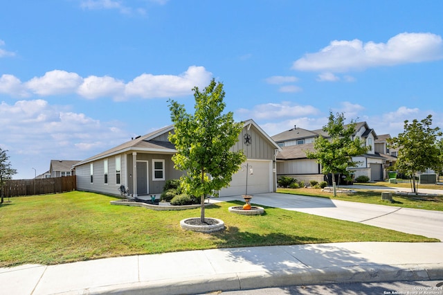 view of front of property with a front yard and a garage