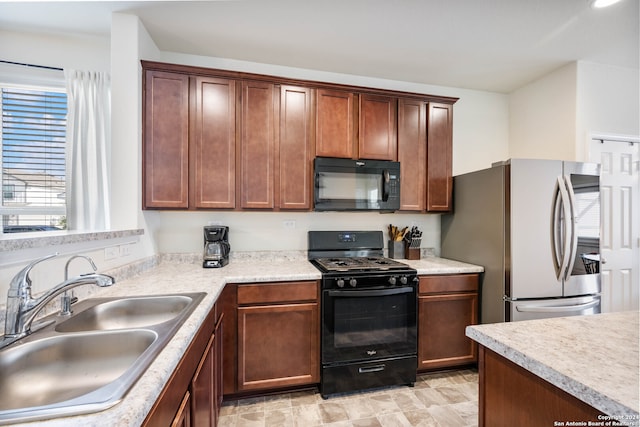 kitchen featuring sink and black appliances