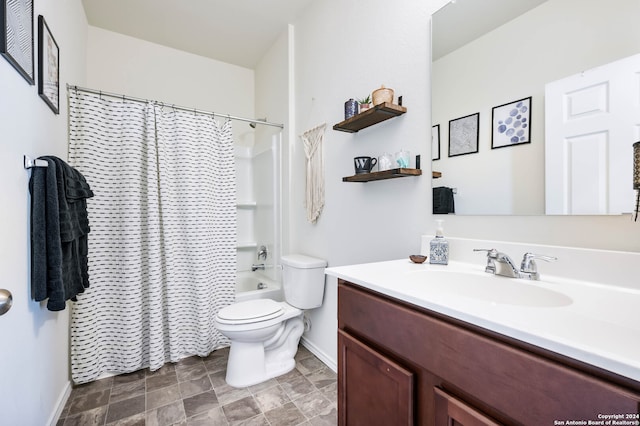 full bathroom with vanity, shower / tub combo, and toilet