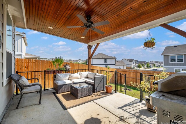 view of patio / terrace with a ceiling fan, a fenced backyard, outdoor lounge area, and a residential view