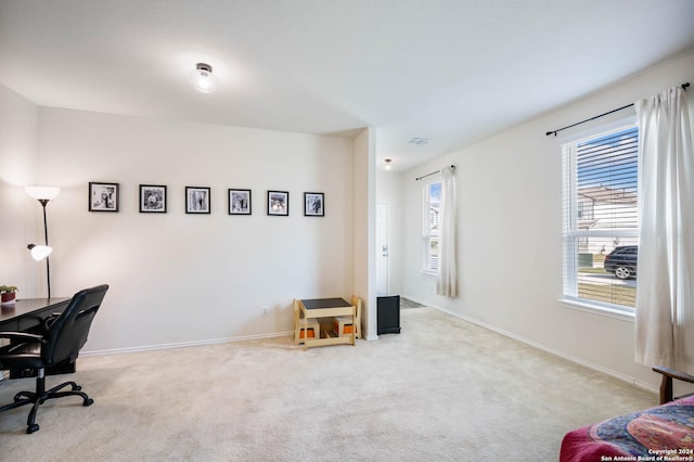 carpeted office space with baseboards