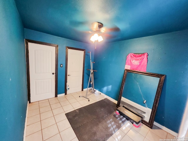 interior space featuring ceiling fan