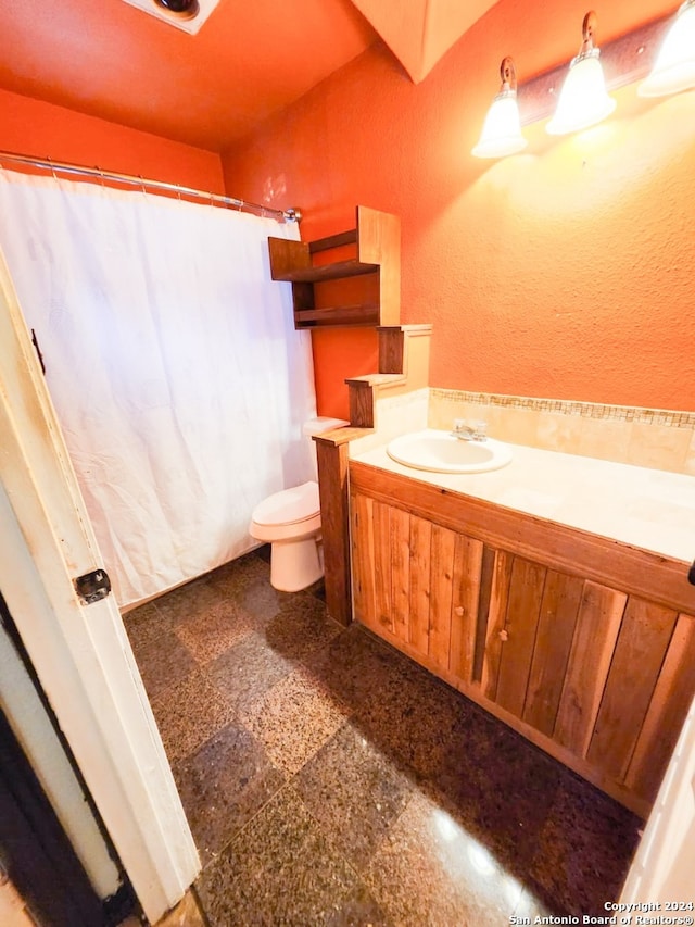 bathroom with vanity and toilet