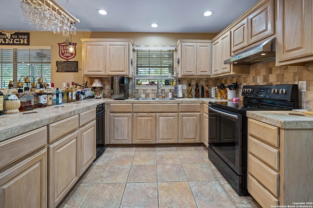 kitchen featuring tasteful backsplash, black range with electric stovetop, extractor fan, light brown cabinetry, and sink