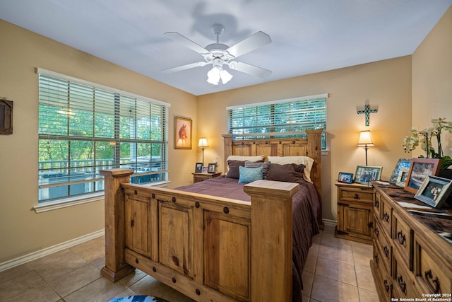 bedroom with light tile patterned floors and ceiling fan