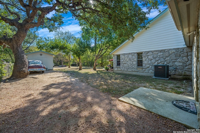 view of yard featuring central AC