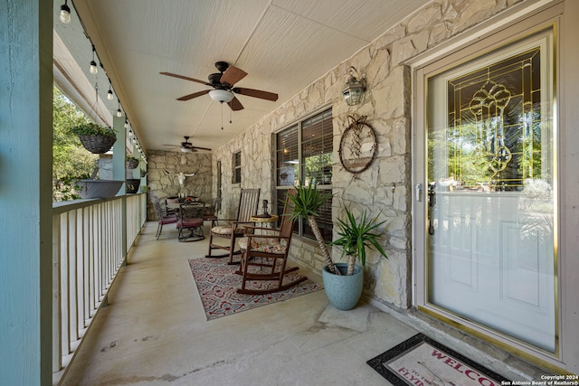 view of patio with a porch and ceiling fan