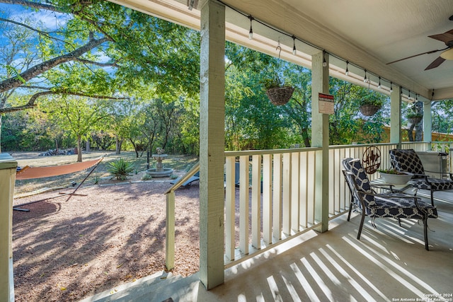 exterior space with ceiling fan