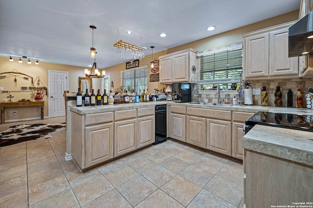 kitchen featuring light brown cabinetry, kitchen peninsula, hanging light fixtures, wall chimney exhaust hood, and decorative backsplash