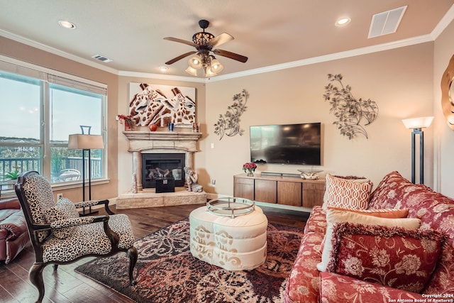 living room with crown molding, hardwood / wood-style flooring, and ceiling fan