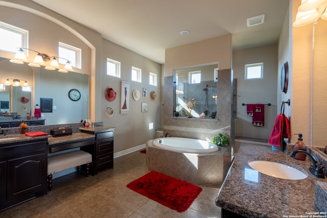 bathroom featuring vanity, independent shower and bath, and tile patterned flooring