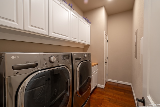 laundry room featuring electric panel, washer and clothes dryer, dark hardwood / wood-style floors, and cabinets