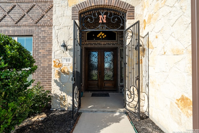 property entrance featuring french doors