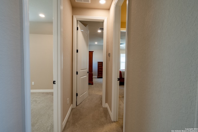 hallway with light carpet