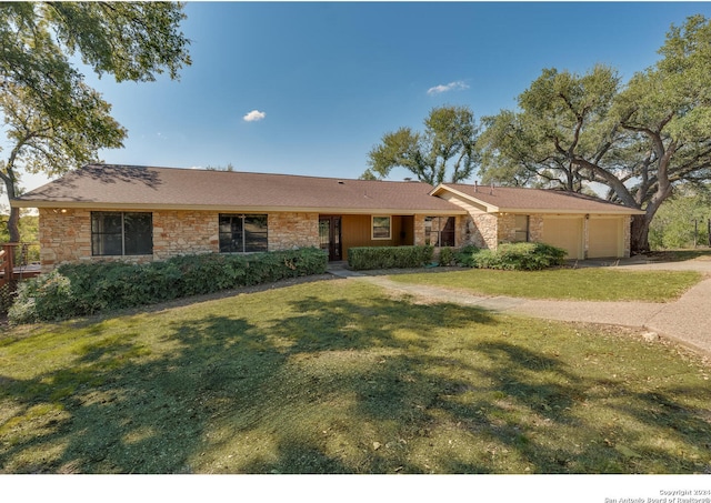 ranch-style house with a front lawn and a garage