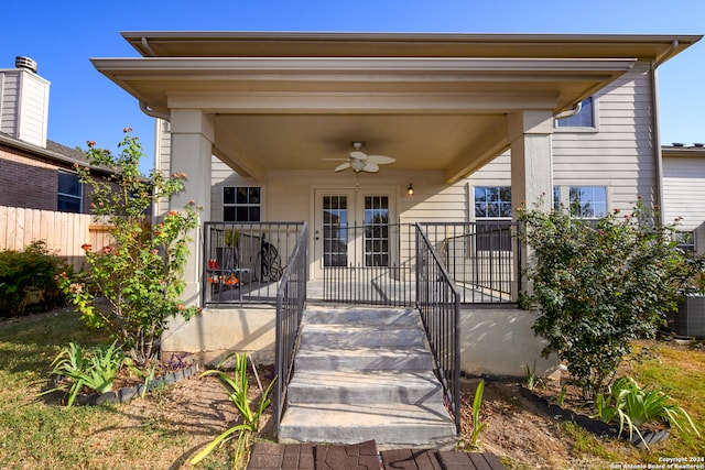 view of exterior entry featuring ceiling fan