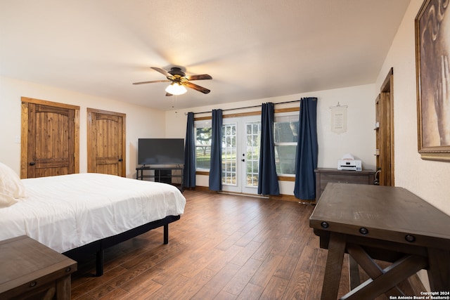 bedroom featuring dark hardwood / wood-style floors, access to exterior, and ceiling fan