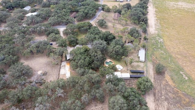 birds eye view of property with a rural view