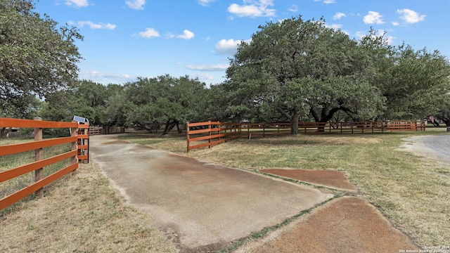 view of yard with a rural view