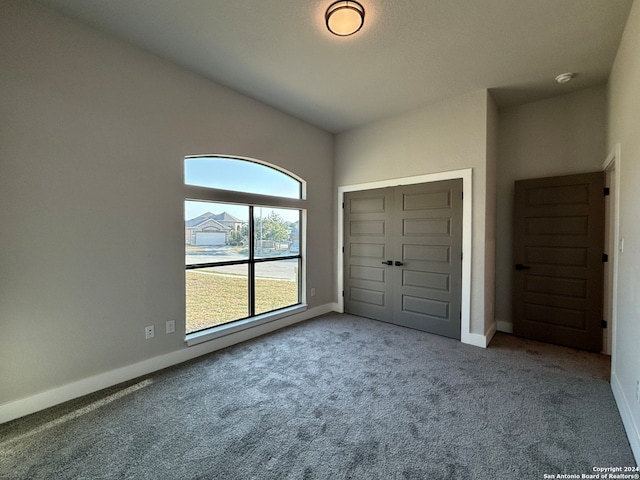 unfurnished bedroom with carpet floors and a closet