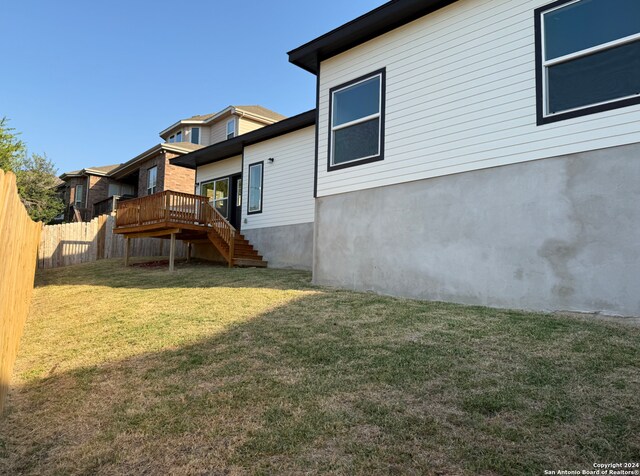 view of yard with a wooden deck