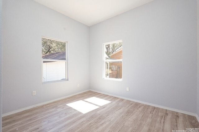 spare room with light wood-type flooring